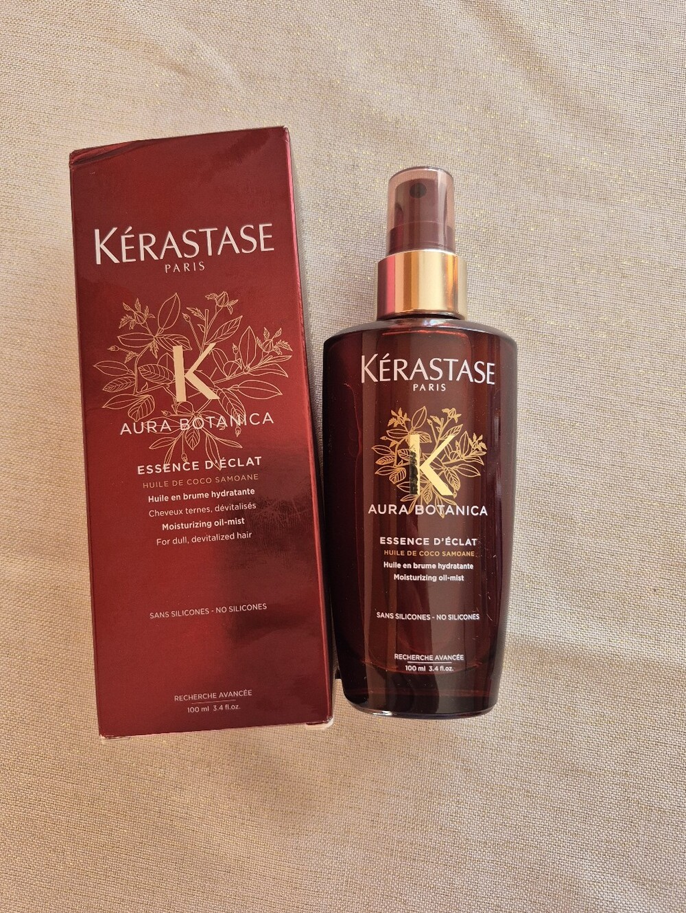 Kérastase Aura Botanica Moisturizing Oil-Mist in Deep Red-Brown Bottle